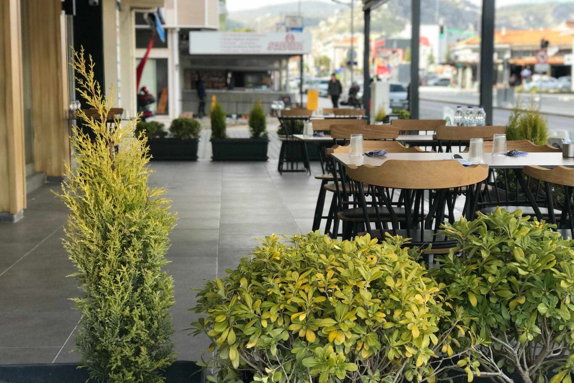 A row of tables outside a restaurant