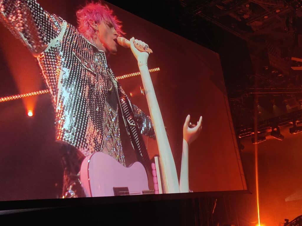 Machine Gun Kelly on the big screen at his Mainstream Sellout tour